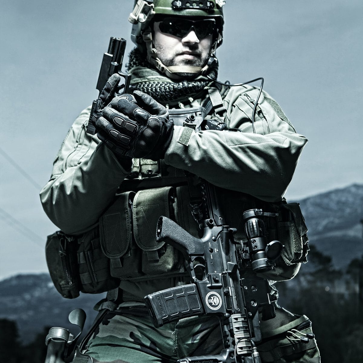 man in green camouflage uniform holding rifle