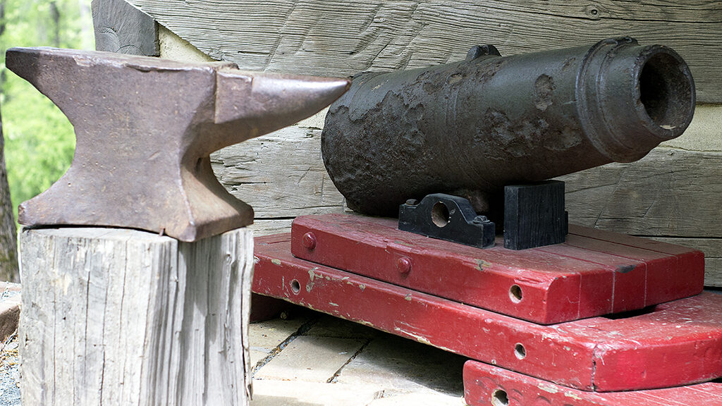 photo of an antique anvil and canon